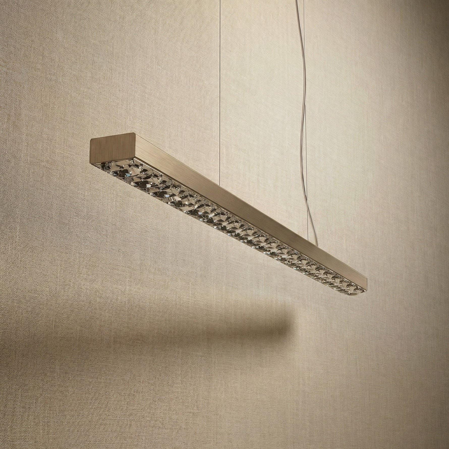 Yiosi Drake 51 inch linear crystal chandelier in modern American dining room with warm ambient glow