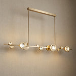 Crystal linear pendant over kitchen island marble countertop — Yiosi Eclipse linear chandelier