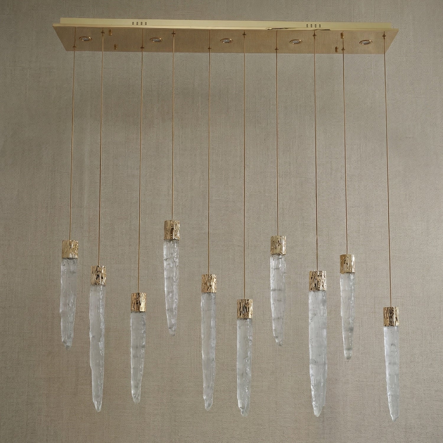Yiosi Halsey 47 inch K9 crystal icicle linear chandelier with gold finish — modern dining pendant