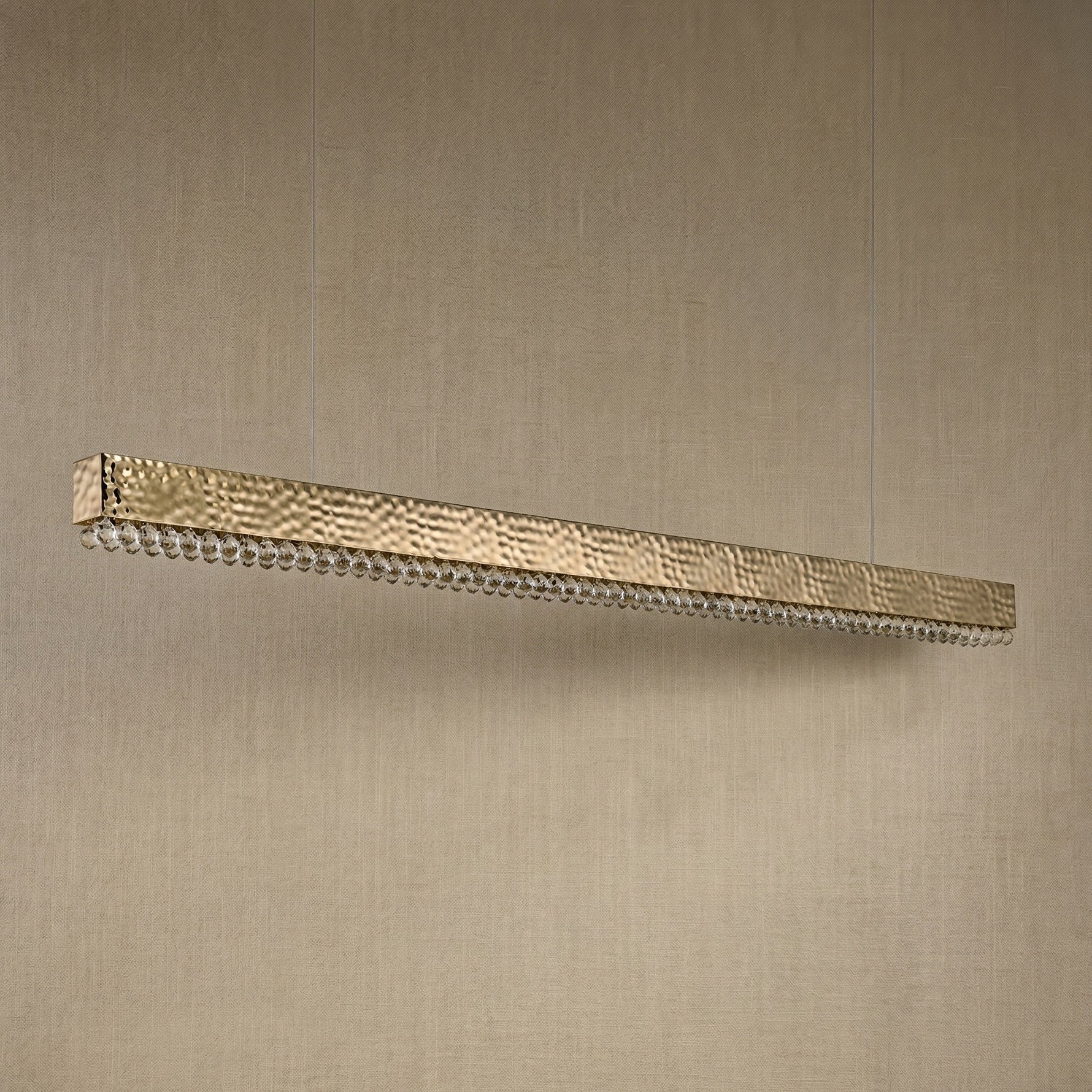 Yiosi Hudson 50 inch linear crystal bar chandelier in modern American dining room with warm glow