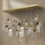Yiosi Knox 47 inch linear fluted glass chandelier in modern American dining room with warm glow