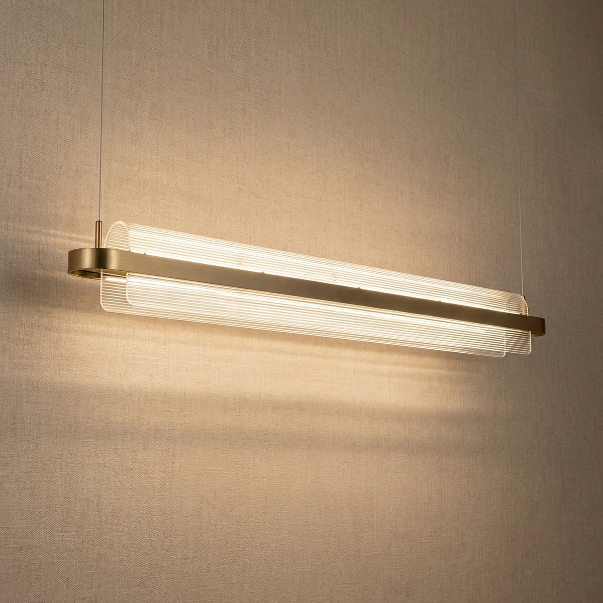 Yiosi Ribbon acrylic ribbed glass linear chandelier with antique brass finish — modern dining pendant