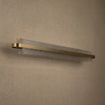 Acrylic ribbed linear pendant over kitchen island marble countertop — Yiosi Ribbon chandelier