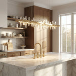 47 inch linear crystal pendant over kitchen island marble countertop — Yiosi Nora chandelier
