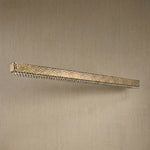 Yiosi Hudson 50 inch linear crystal bar chandelier in modern American dining room with warm glow