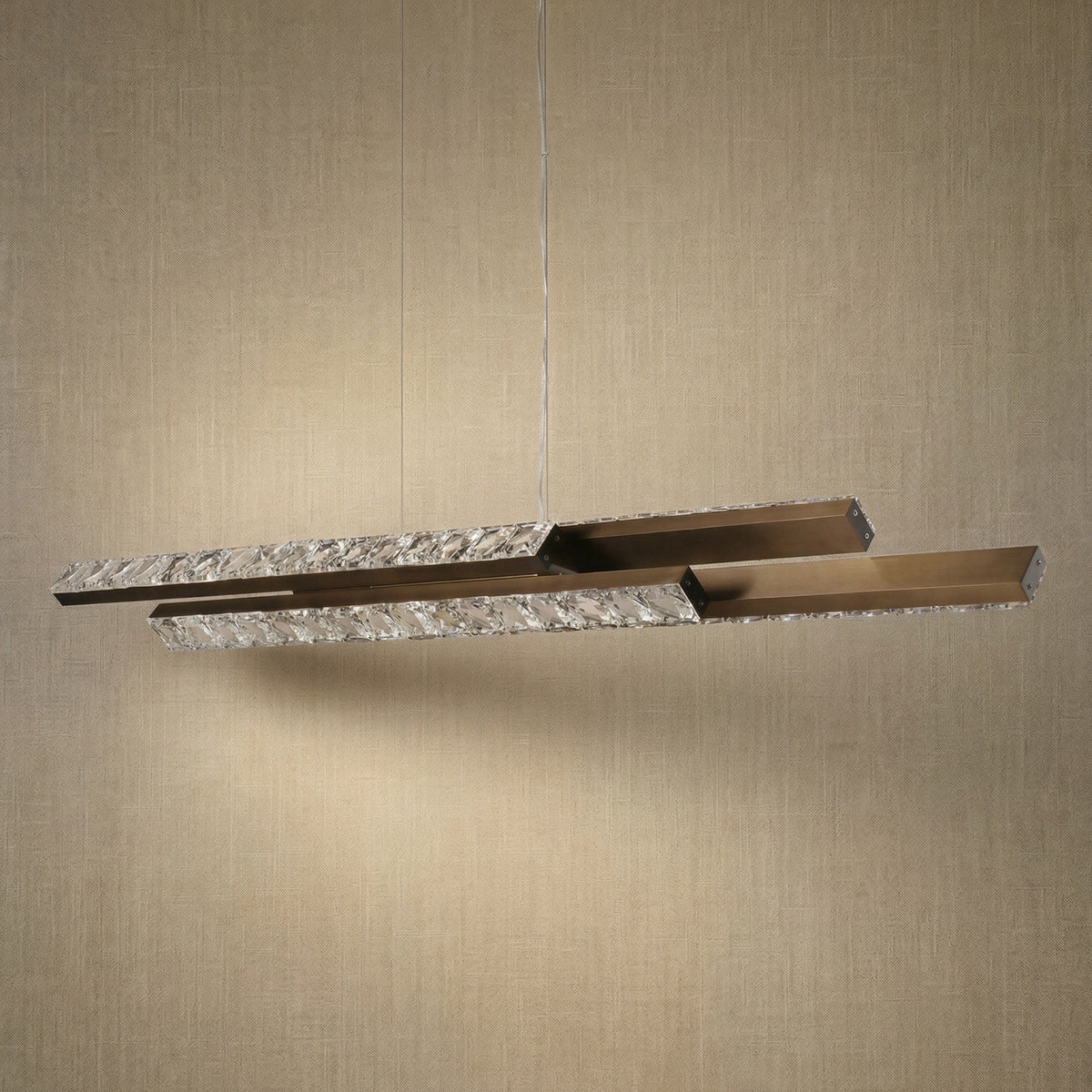 Yiosi Drake 54 inch linear crystal chandelier in modern American dining room with warm ambient glow