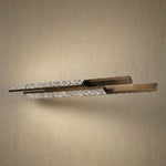 Yiosi Drake 54 inch linear crystal chandelier in modern American dining room with warm ambient glow