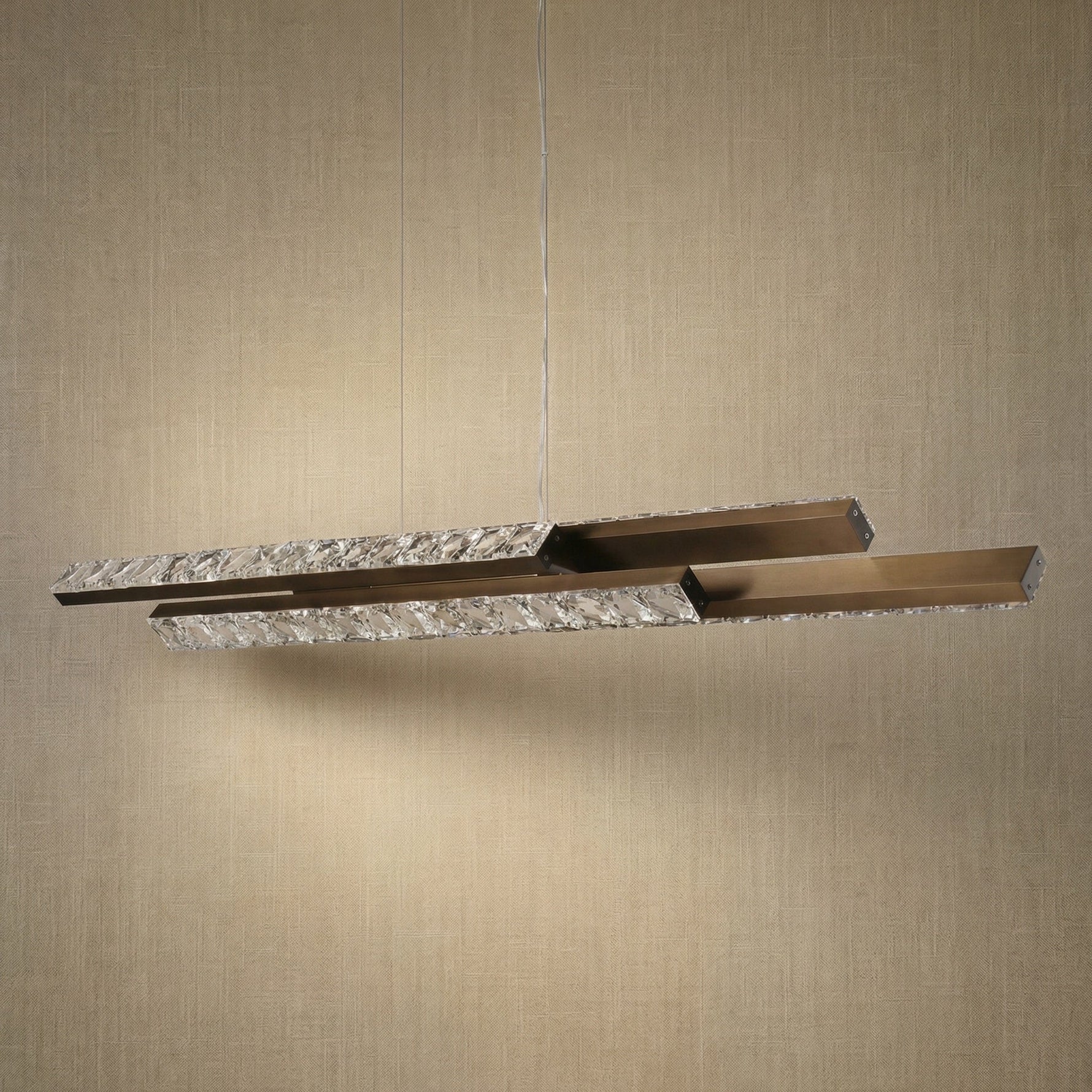 Yiosi Drake 54 inch linear crystal chandelier in modern American dining room with warm ambient glow