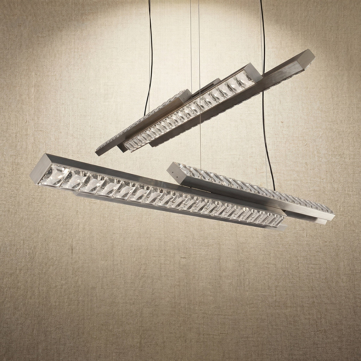 Yiosi Drake 63 inch linear crystal chandelier in modern American dining room with warm ambient glow