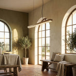 37 inch linear crystal pendant over kitchen island marble countertop — Yiosi Drake antique brass chandelier
