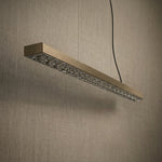 Yiosi Drake 37 inch linear crystal chandelier in modern American dining room with warm ambient glow