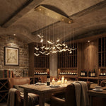 Yiosi Crane cascading glass linear chandelier in luxury American dining setting, warm evening glow