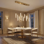 Crystal icicle pendant light over kitchen island marble countertop — Yiosi Halsey 47 inch linear chandelier