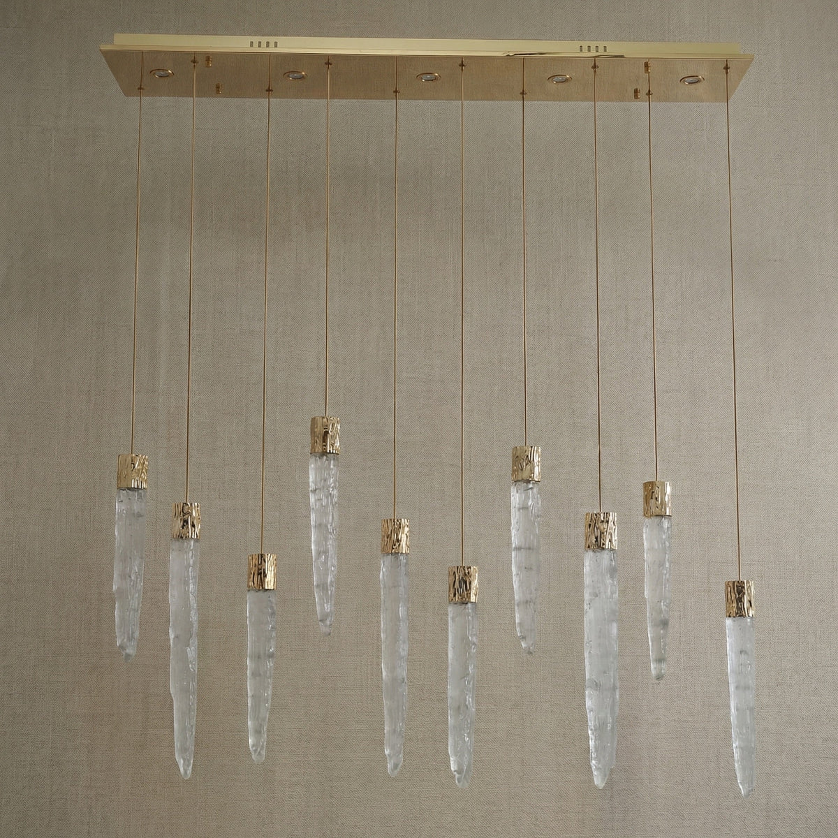 Yiosi Halsey 47 inch K9 crystal icicle linear chandelier with gold finish — modern dining pendant