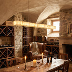 Yiosi Madison 48 inch alabaster linear chandelier in modern American interior with warm ambient glow