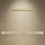 Modern dining room 48 inch Style B alabaster linear chandelier over long wooden table — Yiosi Madison natural stone pendant