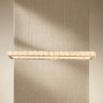 Yiosi Madison 48 inch Style B alabaster linear chandelier with champagne gold finish — modern dining pendant