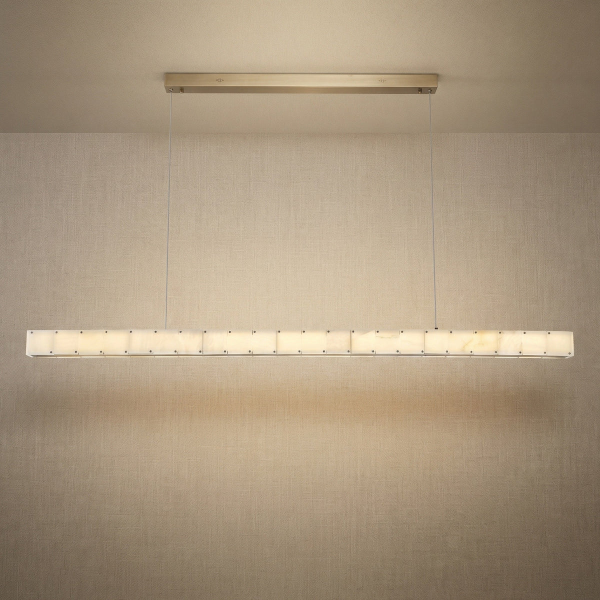 Yiosi Madison 63 inch alabaster linear chandelier with champagne gold finish — modern dining pendant