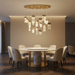 Modern dining room 39 inch oval fluted glass chandelier over long table — Yiosi Knox champagne gold