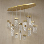 Yiosi Knox 39 inch oval fluted glass chandelier in modern American dining room with warm glow