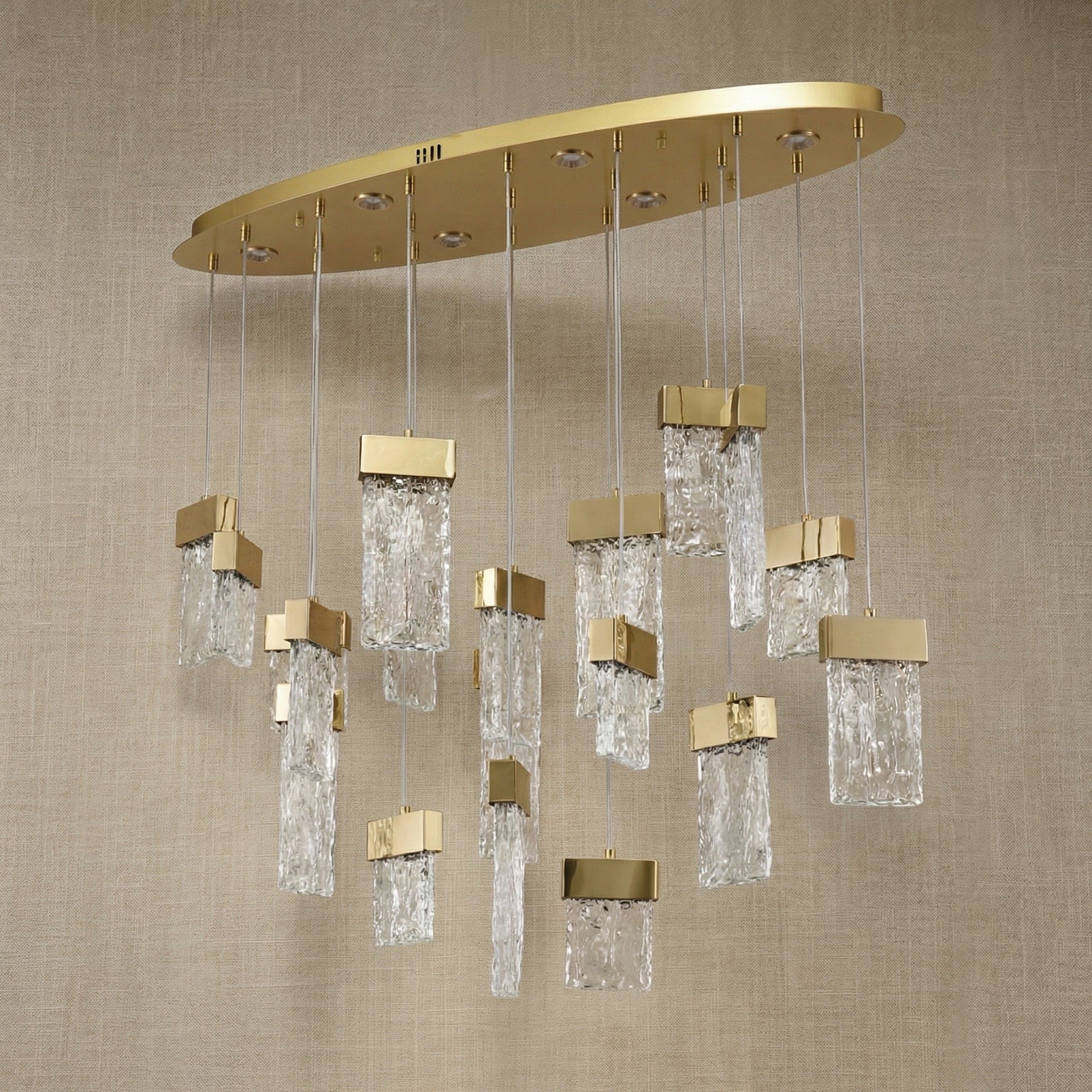 Yiosi Knox 39 inch oval fluted glass chandelier in modern American dining room with warm glow
