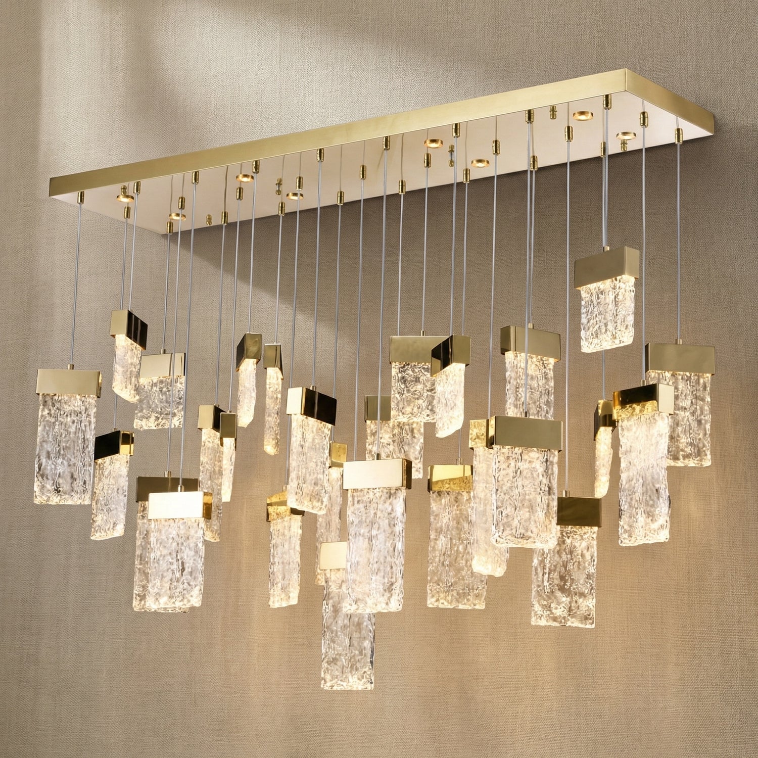 Yiosi Knox 47 inch linear fluted glass chandelier with champagne gold finish — modern dining pendant