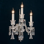 Yvora Chrome Candle Crystal 3-Light Wall Sconce 13.8" on a deep teal-blue wall