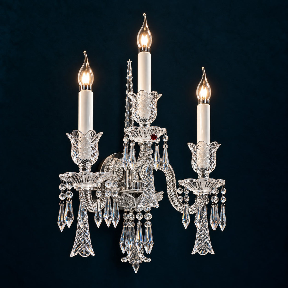 Yvora Chrome Candle Crystal 3-Light Wall Sconce 13.8" on a deep teal-blue wall