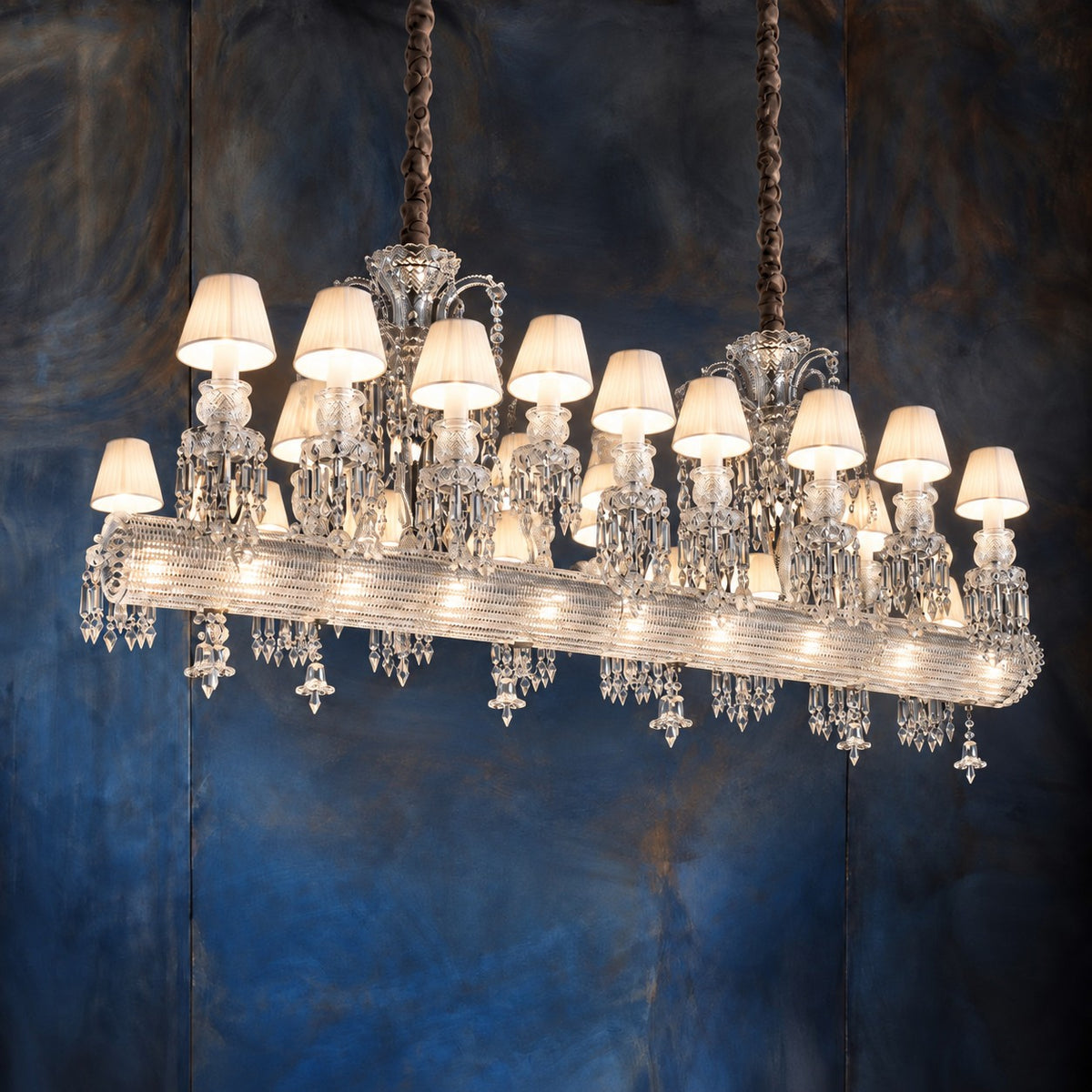 Zalvera Black Crystal 36-Light Linear Chandelier 70.9" on a dark blue-grey wall